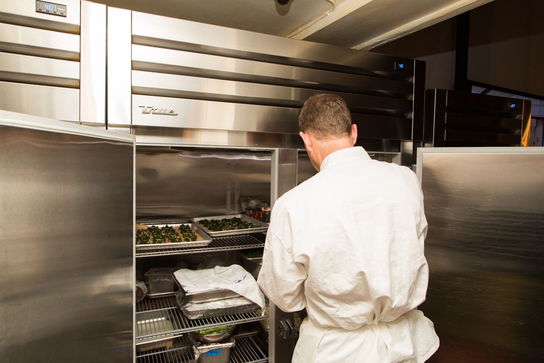 chef’s kitchen - chef browsing food items in fridge