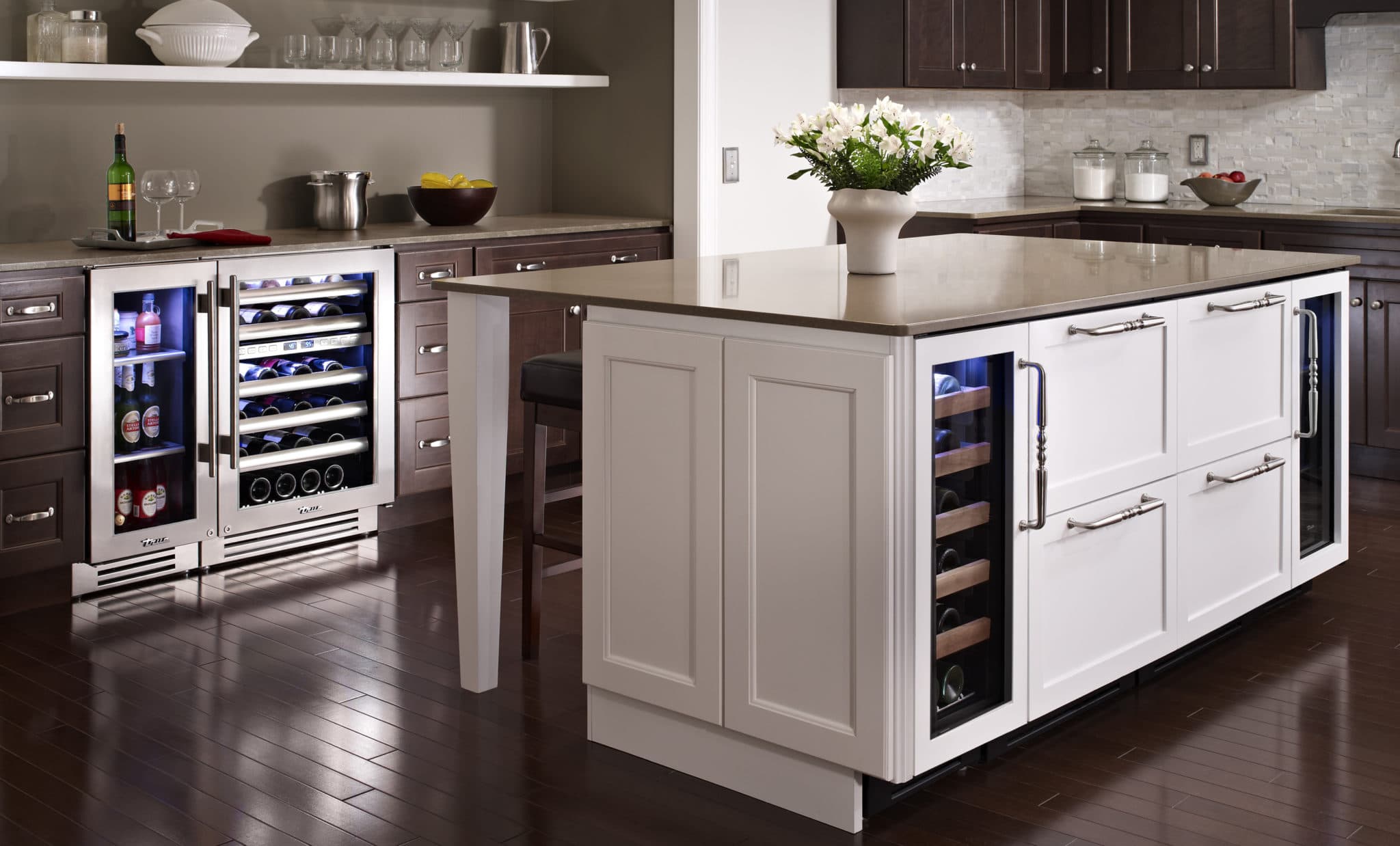 HollwoodZones - Undercounter Beverage Refrigerator and Wine Columns - Dark Wood Floors and White Island Countertop