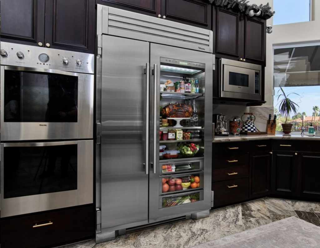 Stainless Steel Refrigerator and Black Cabinets