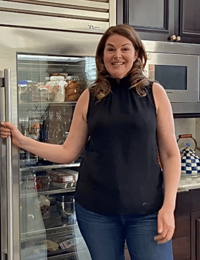 Elizabeth Blau in front of Refrigerator