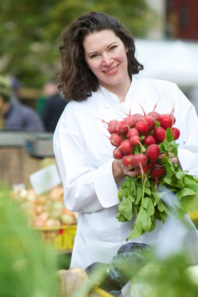 Headshot - Person Holding Radishes