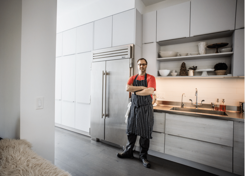 Chef Wylie Dufresne Standing with the Coolest Fridge Ever