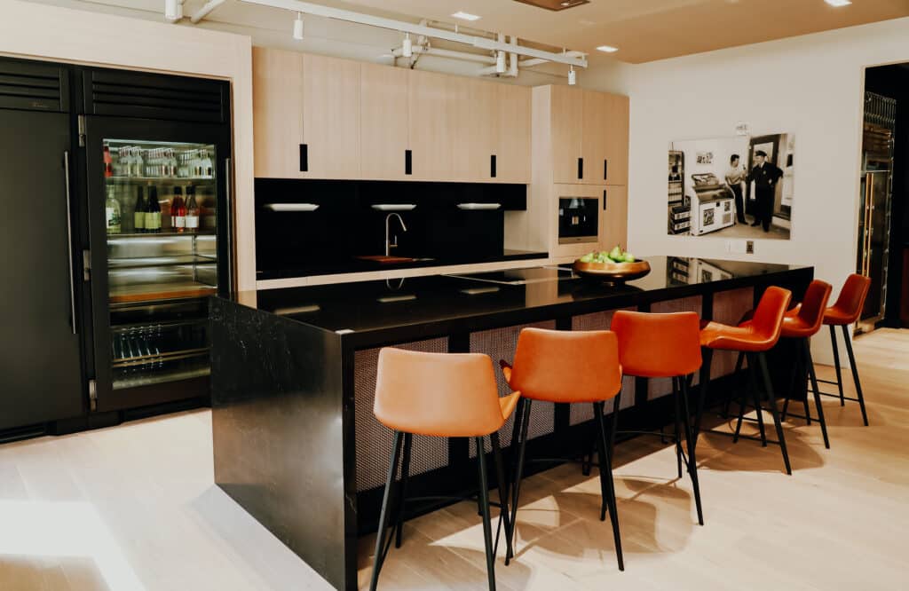Black Refrigerator and Black Island Counter Seating Display