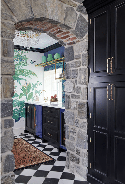 Stone Archway with Black and White Checkered Tiled Flooring with Undercounter Blue Refrigerators